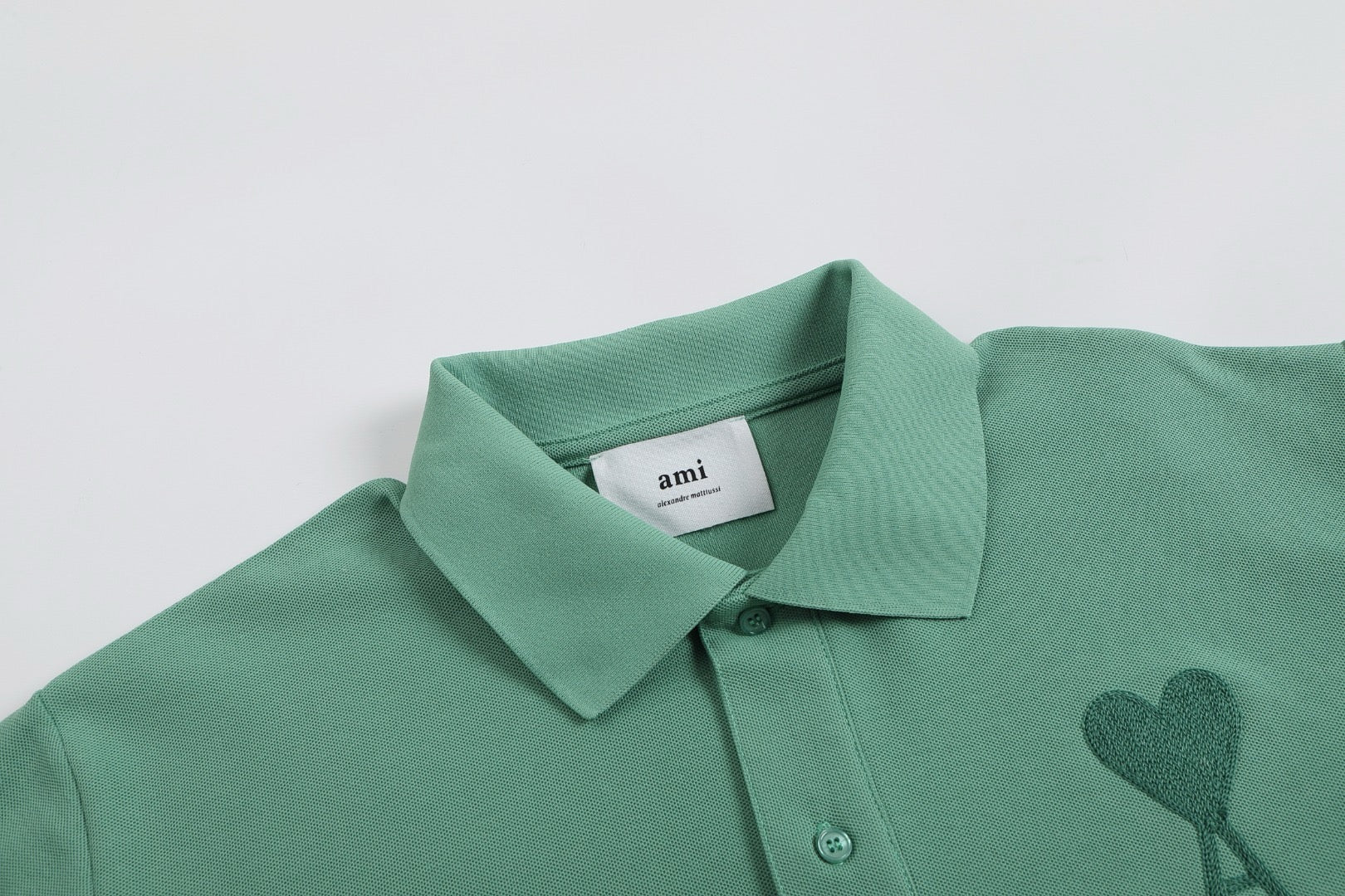 Polo vert à petit logo ami de cœur vert