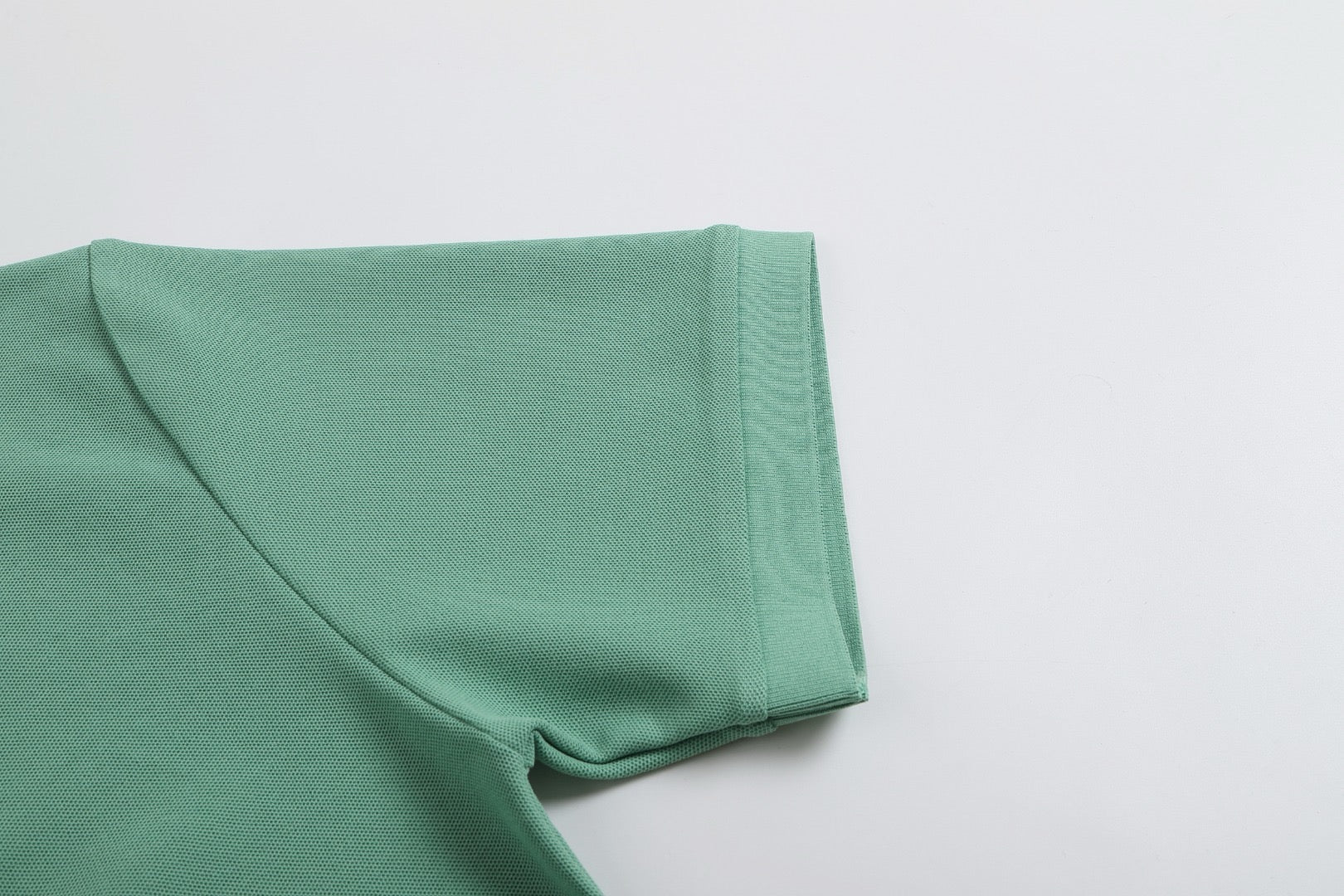 Polo vert à petit logo ami de cœur vert