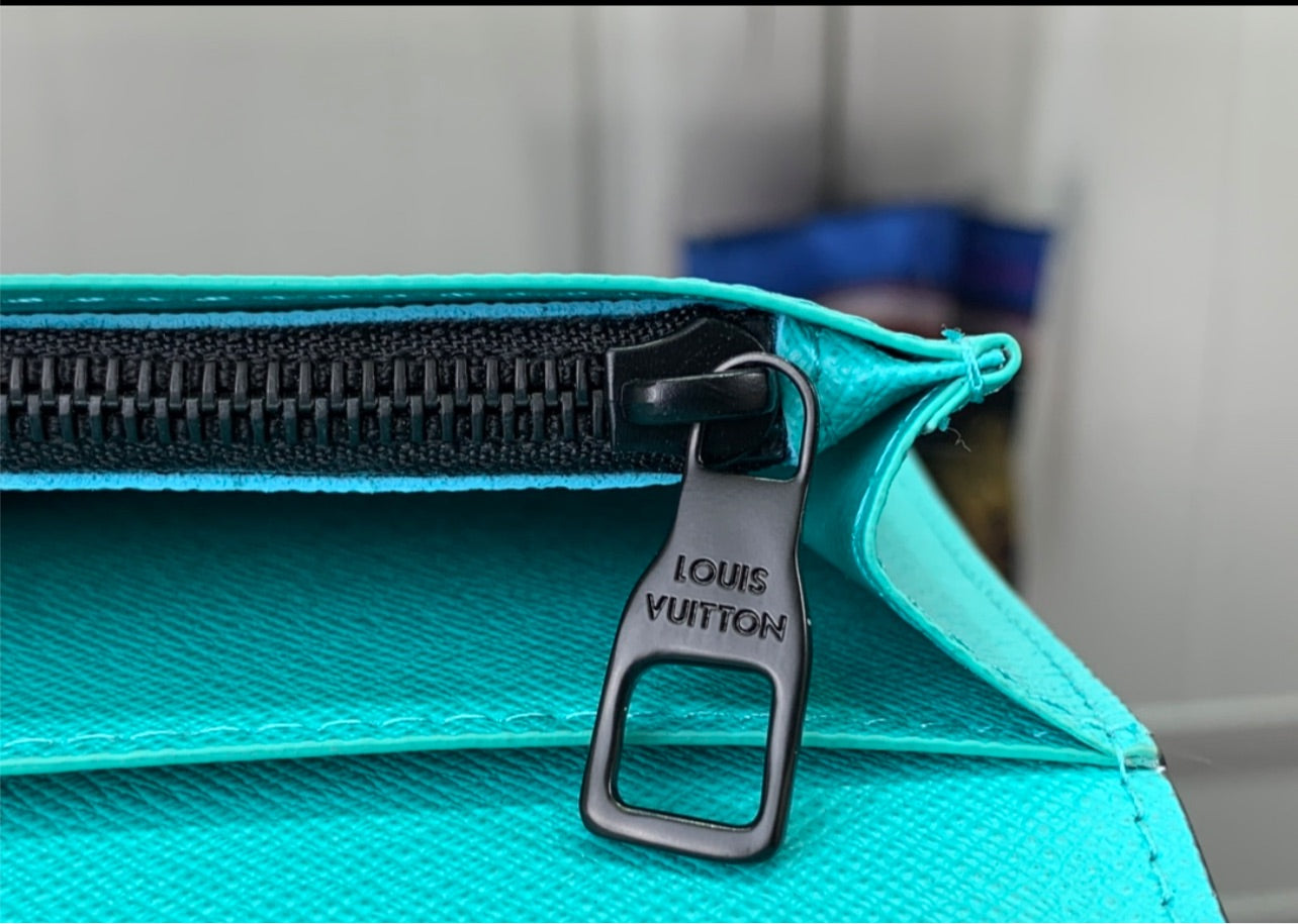 Lv coin purse and card holder.