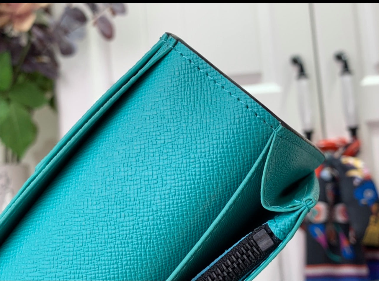 Lv coin purse and card holder.