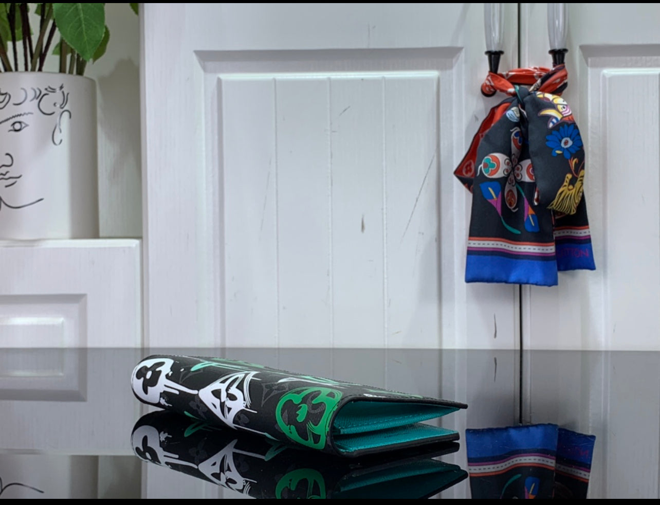 Lv coin purse and card holder.