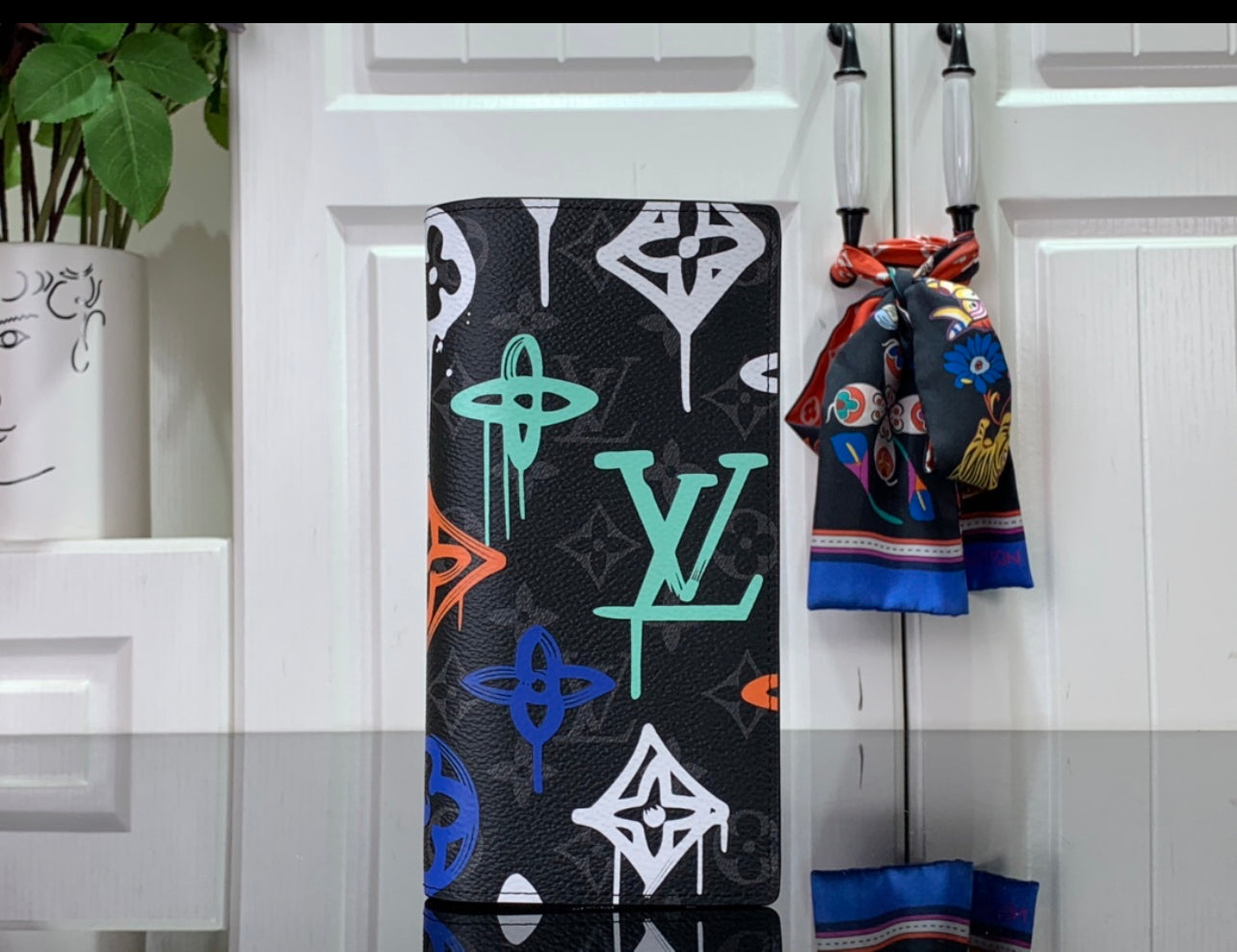 Lv coin purse and card holder.