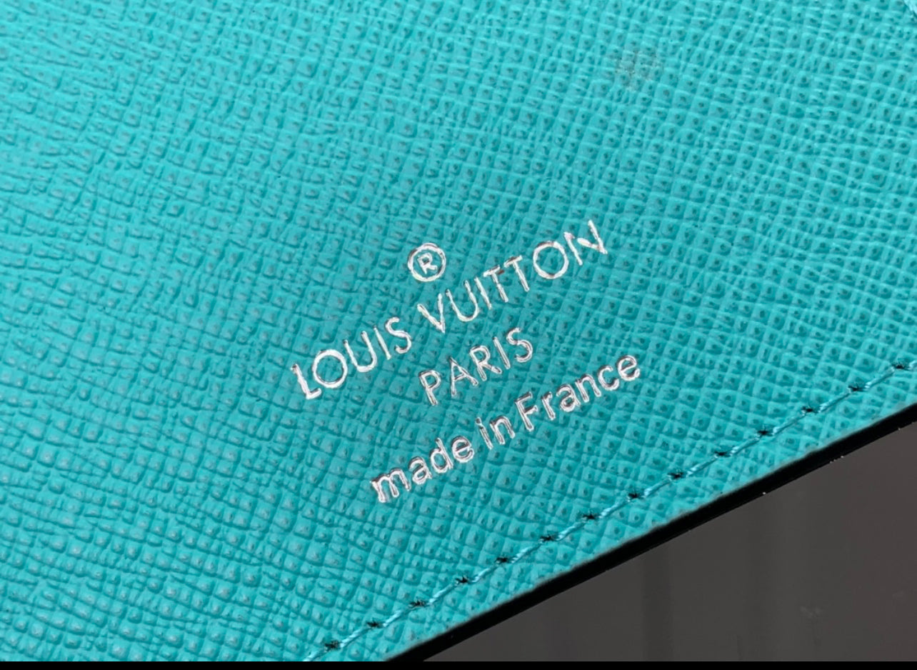 Lv coin purse and card holder.