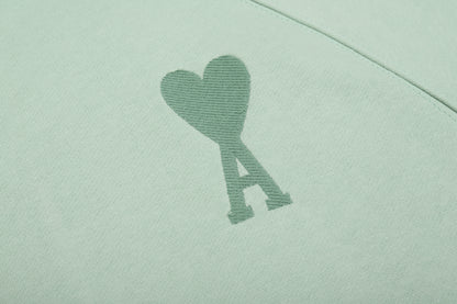 Sweat vert  à petit logo ami de cœur vert