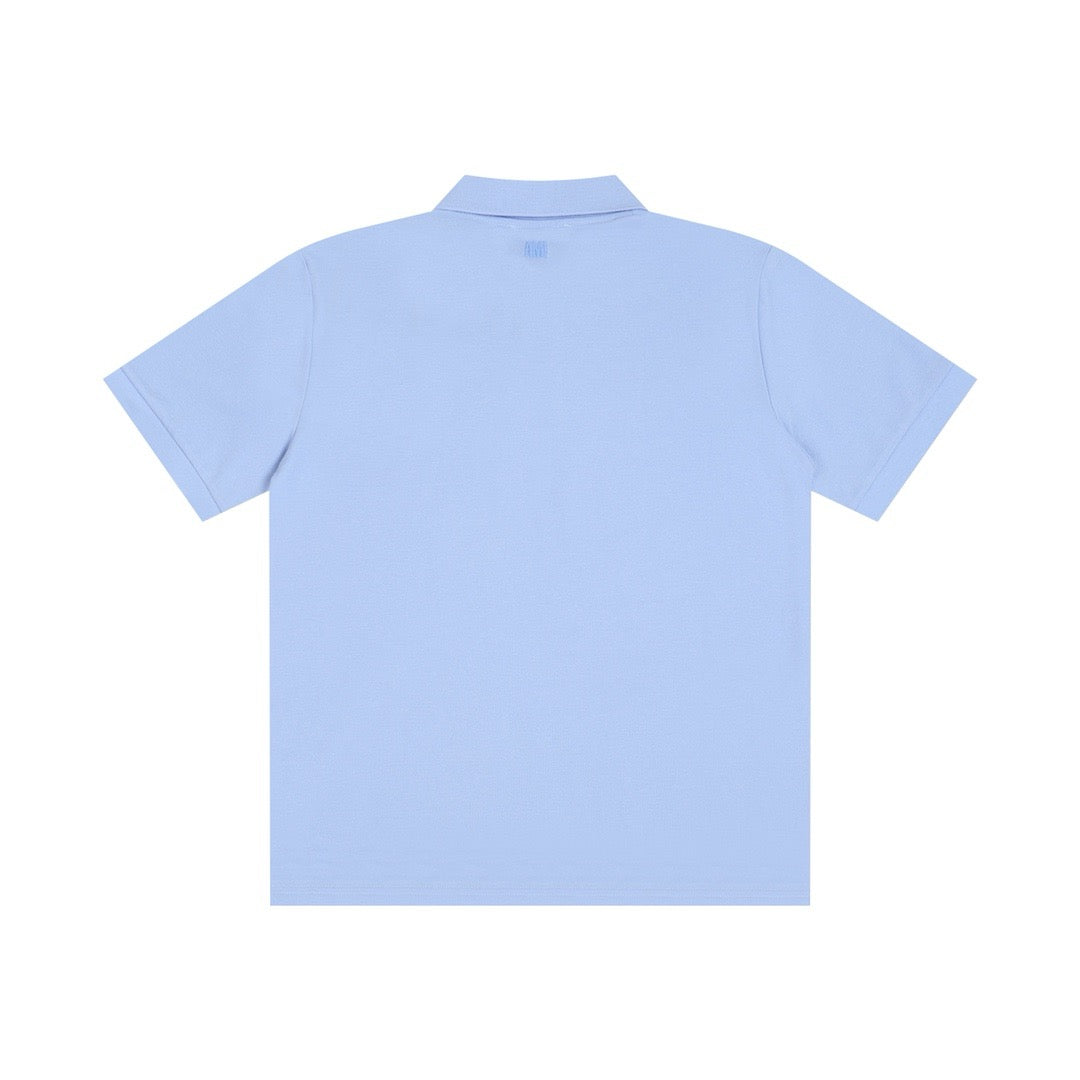 Polo bleu  à petit logo ami de cœur rouge